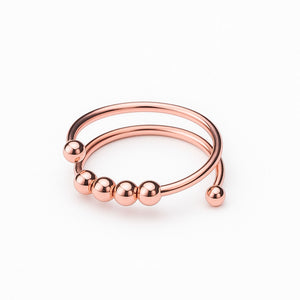 Bague anti-anxiété en or rosegold, finition brillante avec design élégant et perles mobiles